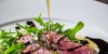 Tagliata di manzo rucola, grana e glassa al balsamico