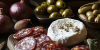 Salame “gentile” , burratina affumicata dalla Puglia , tris di olive, cipolle rosse all’agro